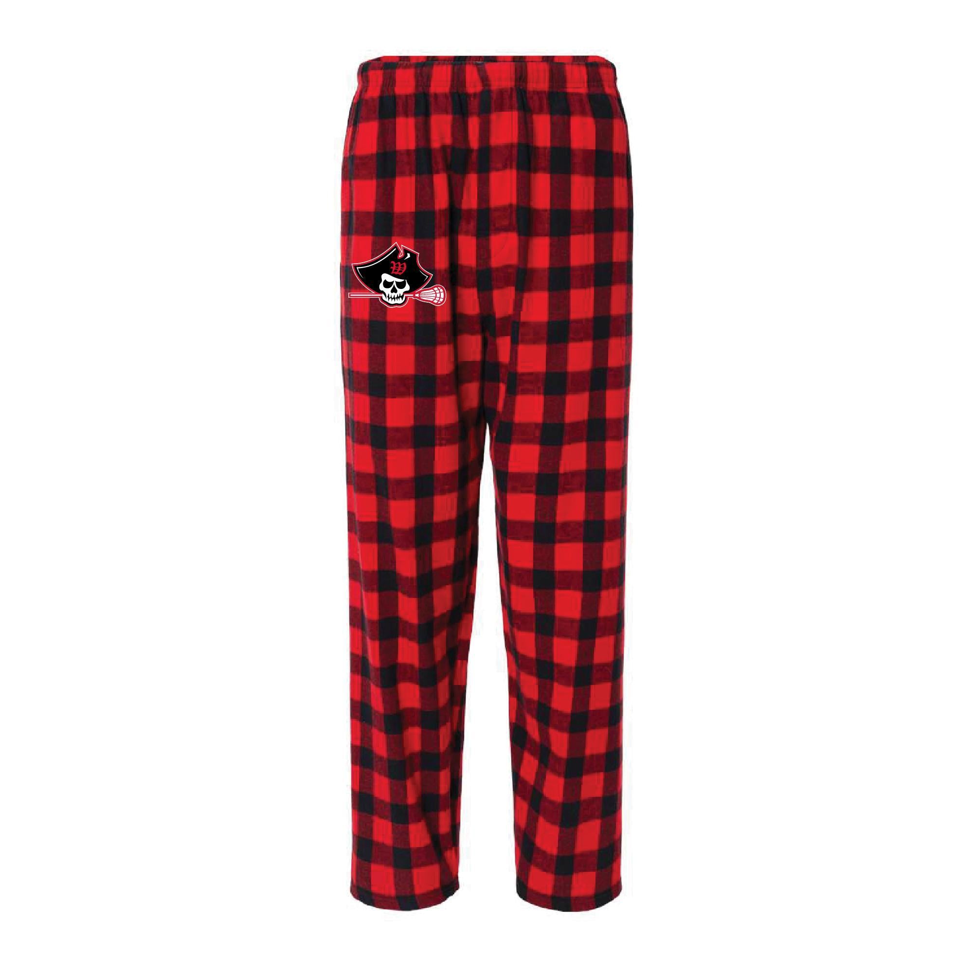 Raider Lax flannel lounge pants in red and black buffalo plaid pattern, featuring a logo patch on the left leg, elastic waistband, and a relaxed fit for comfort