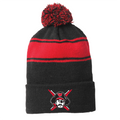 Charcoal gray and red striped knit beanie with large pom-pom on top. Features a Raiders logo patch with crossed swords and pirate face embroidered on the front cuff. Perfect for showing team spirit and staying warm during winter sports events.